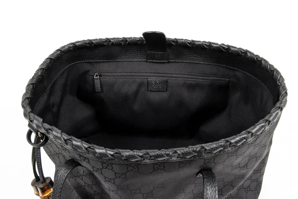 Bolso de mano Gucci para mujer de piel granulada negra con borlas de bambú