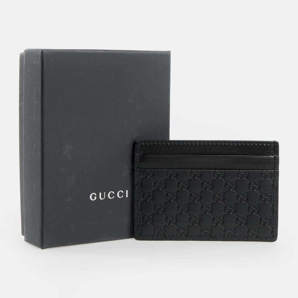 Tarjetero de piel Gucci Guccissima negro
