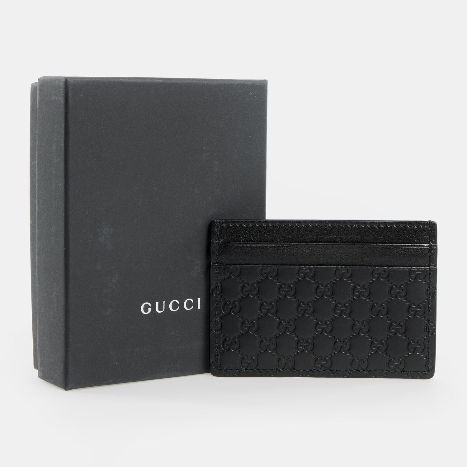 Tarjetero de piel Gucci Guccissima negro