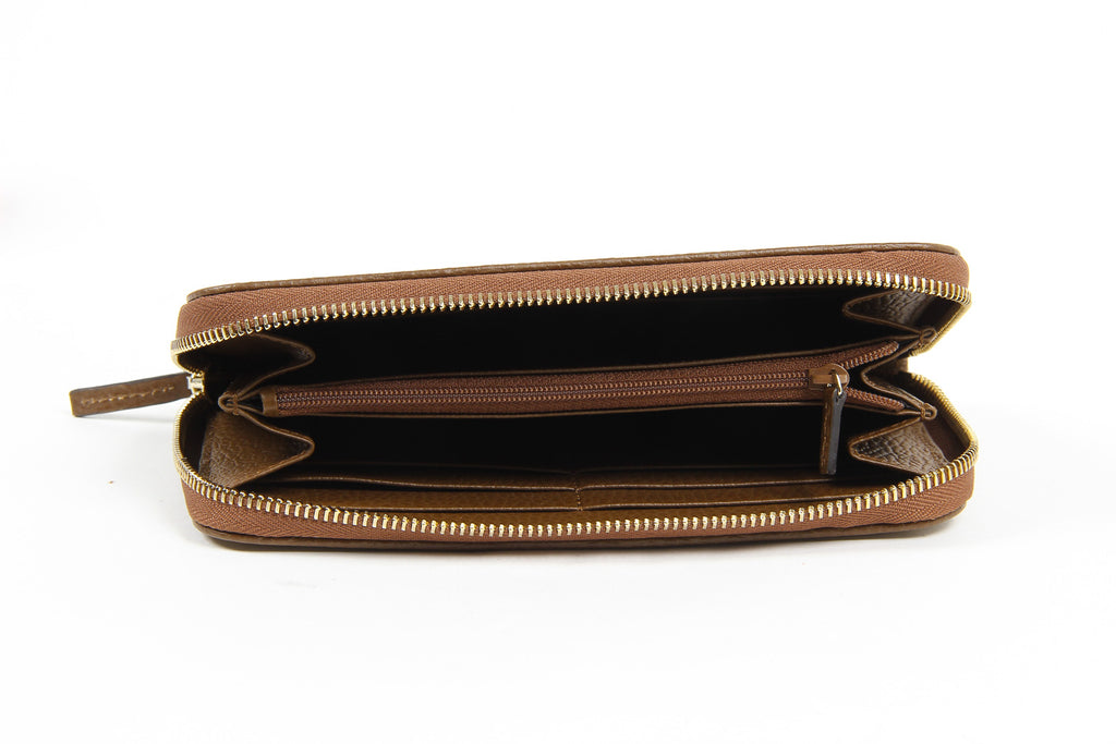 Cartera de mano con cremallera alrededor GG Guccissima de lona con cristales para mujer de Gucci